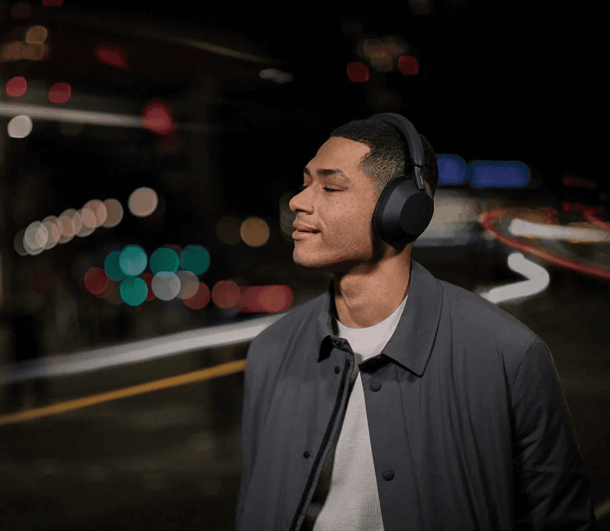 Person wearing WH-1000XM5 headphones